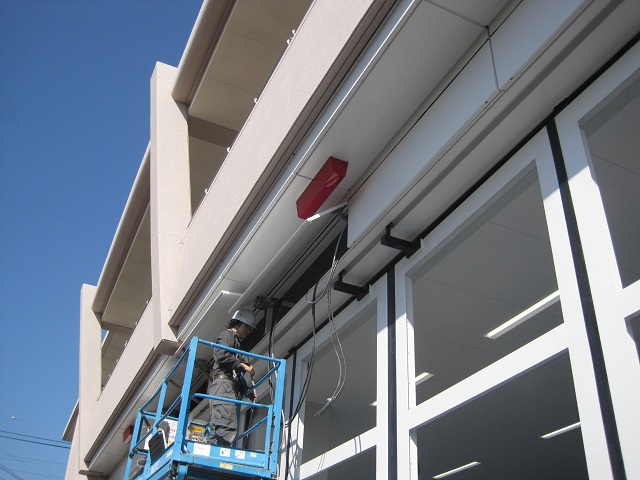 Inspecting the electric driver unit from the access panel at the top