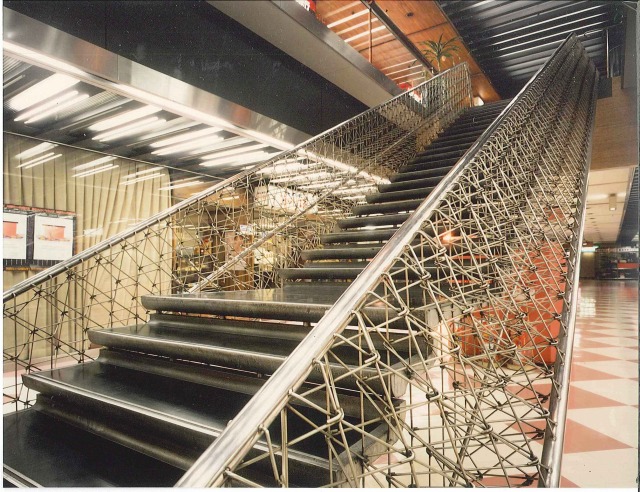 The handrail of "staircase of dreams". The balustrades are made from woven stainless steel round bars.