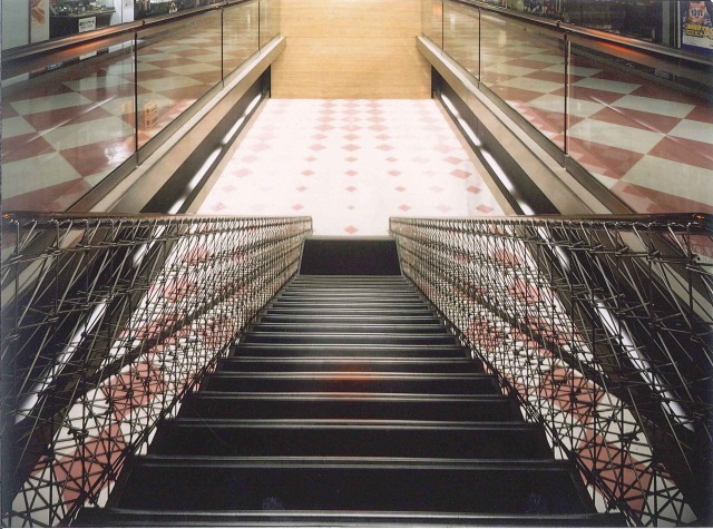 The stairs from the first floor. The woven balustrades allows a B1F view.