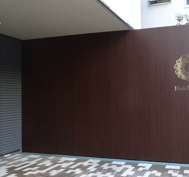 Exterior aluminium panels coated with "wood grain" style, flame resistant approved decorative adhesive sheets