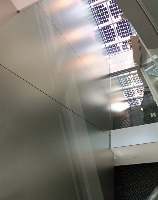 Looking up the atrium from the 2nd floor. The side facing the atrium is diagonally installed.