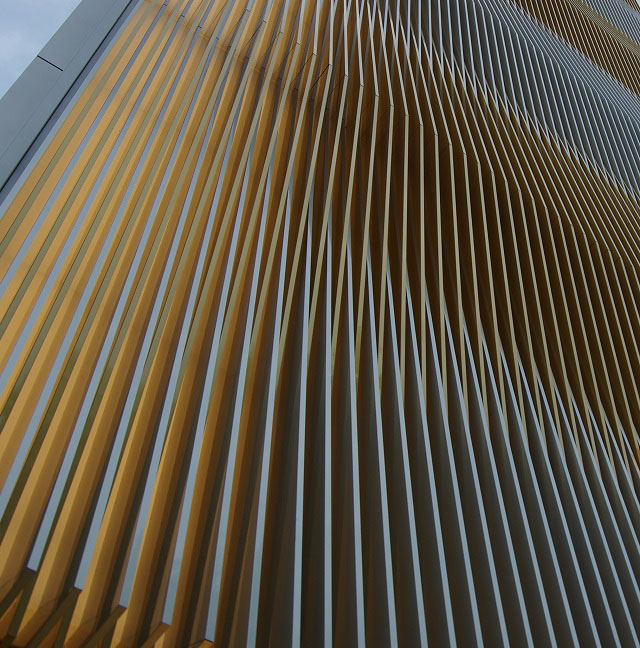 Louvres of alternating colour: silver anodization and gold dyed + anodized aluminium