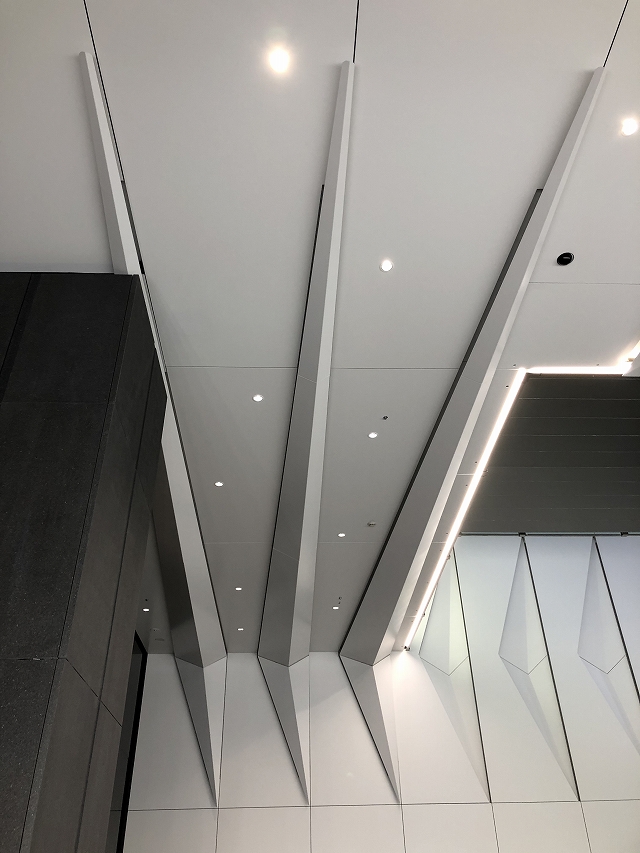 Panels to the right are concavely folded