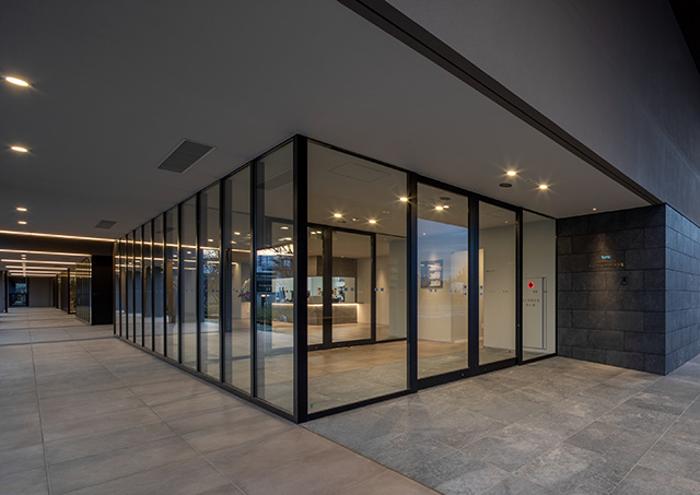 Front exit of the facility. The automatic door frames are also by Kikukawa.